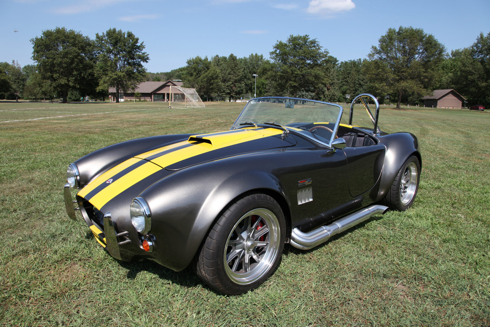 2021 Factory Five Mk4 Roadster, front three-quarter view, Galaxy Grey with Marigold stripes