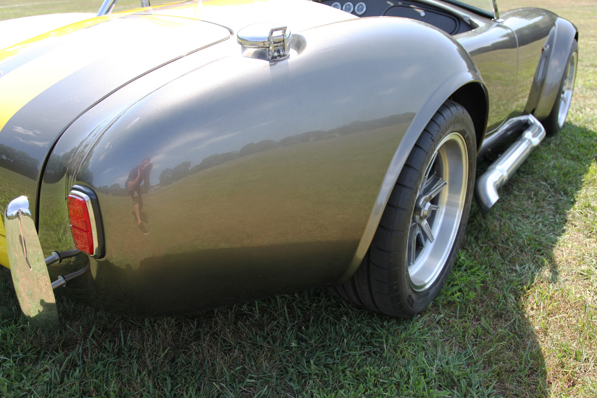 Rear quarter panel with LeMans-style fuel filler cap and side pipes
